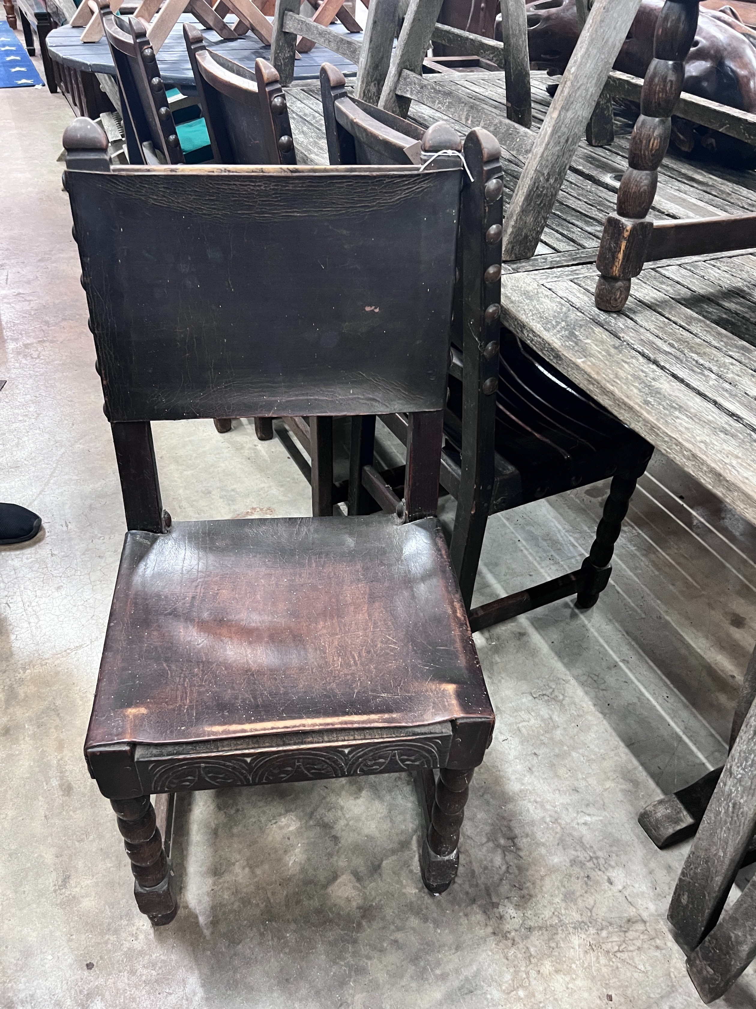 A set of six 17th century style oak dining chairs with leather upholstery *Please note the sale commences at 9am.